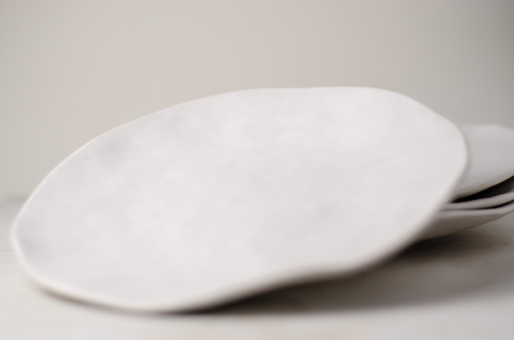 ORBIS 16 cm akmens masės lėkštė natūralios baltos spalvos